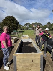 volunteers and residents at Hōhepa Wellington working in the gardens