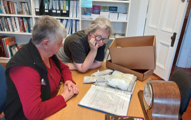Sue Carroll and Jenn Corbitt, Ōtaki Heritage volunteers working on museum archives